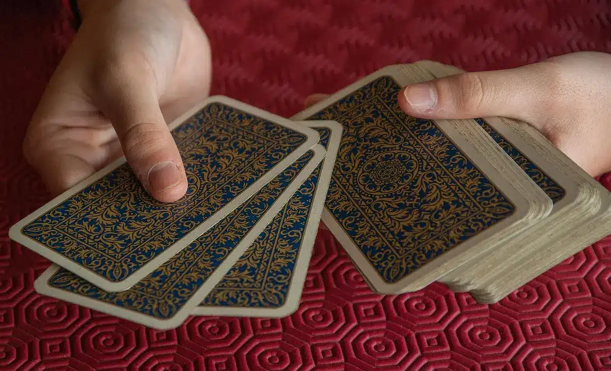 Players seated around a table with role cards and tokens in play