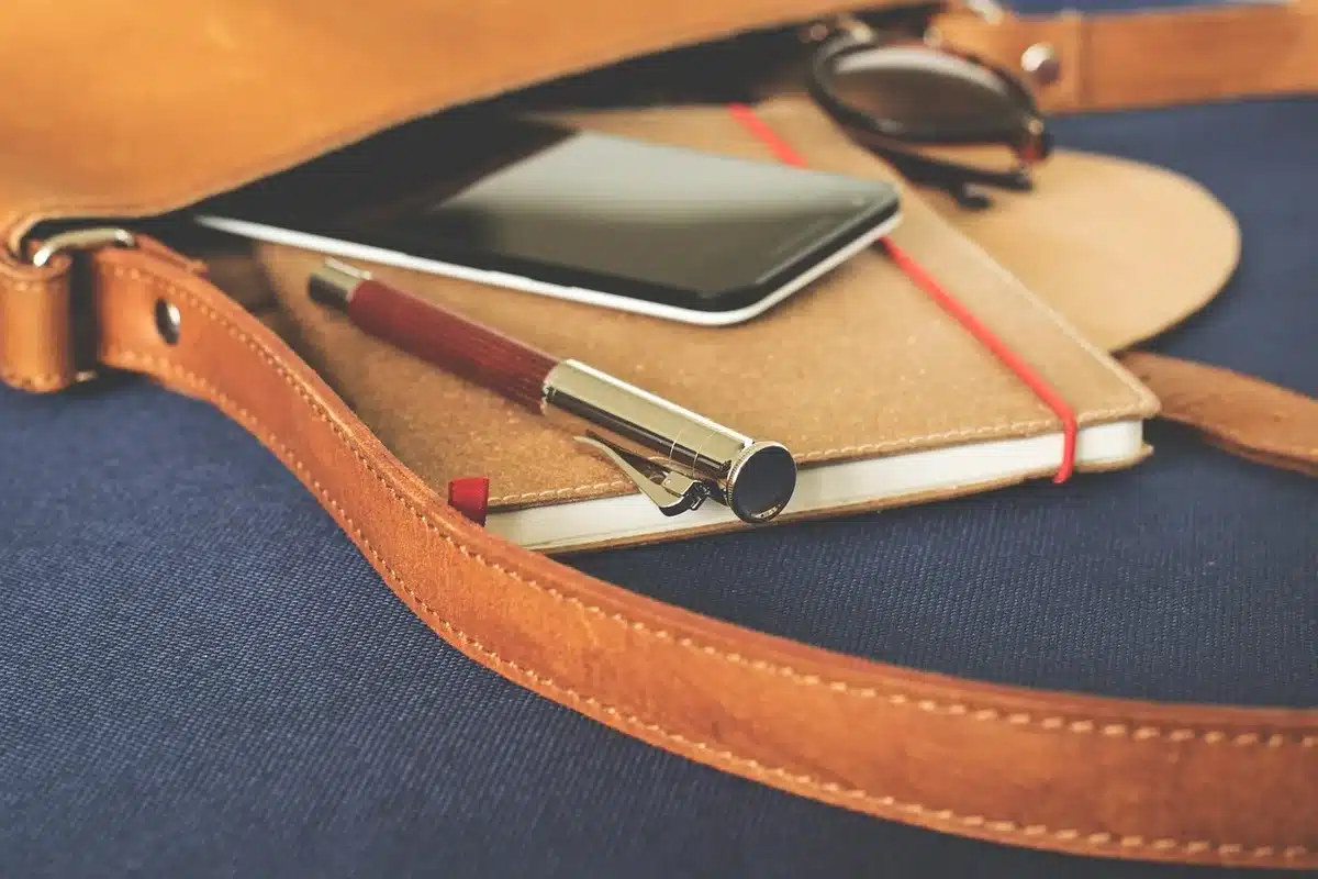Smartphone showing a brief public statement about a concert lineup change
