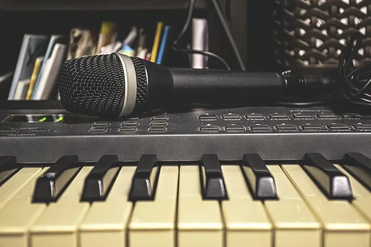 Near-atonal piano keys under moody studio lighting