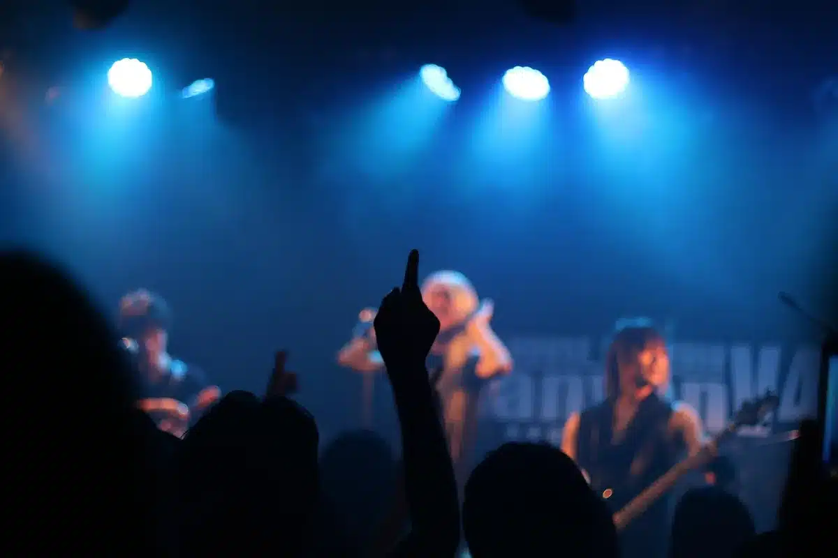 Crowd at a campus concert with R&B performers on stage