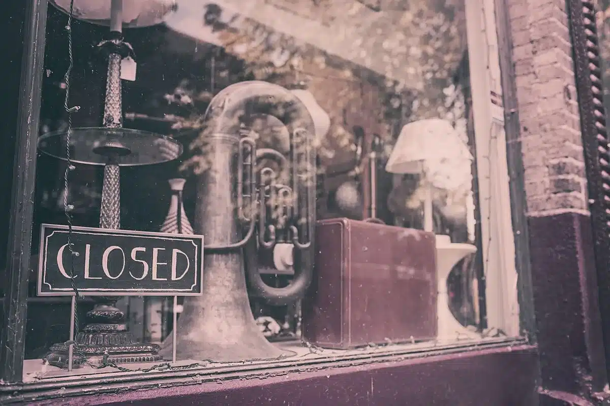 Layered brass instruments and piano in a recording studio with ambient lighting.
