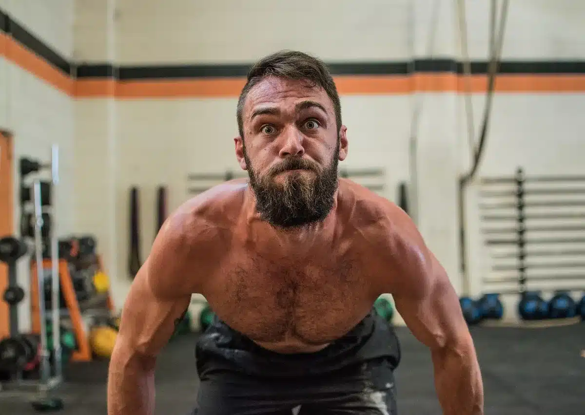 Athlete in deep focus before attempting a heavy lift, showing mental composure and determination