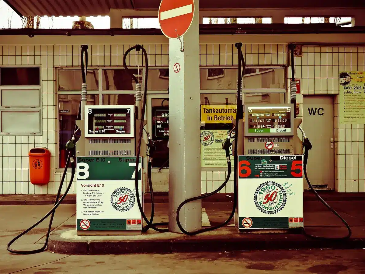 Close-up of diesel pump nozzle and heavy truck