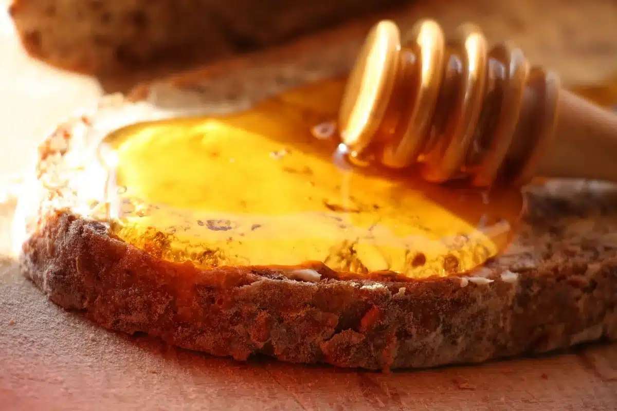 Assortment of unpasteurized dairy and raw produce on a wooden board