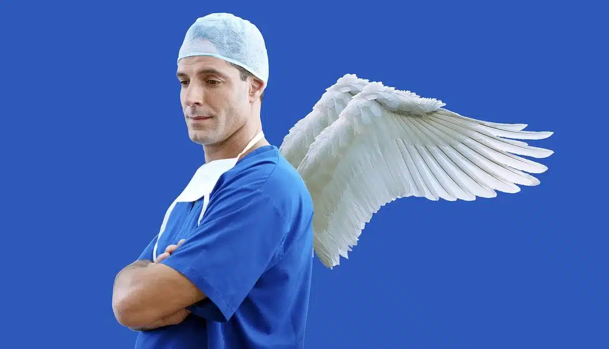 Medical professional administering IV fluids to a patient