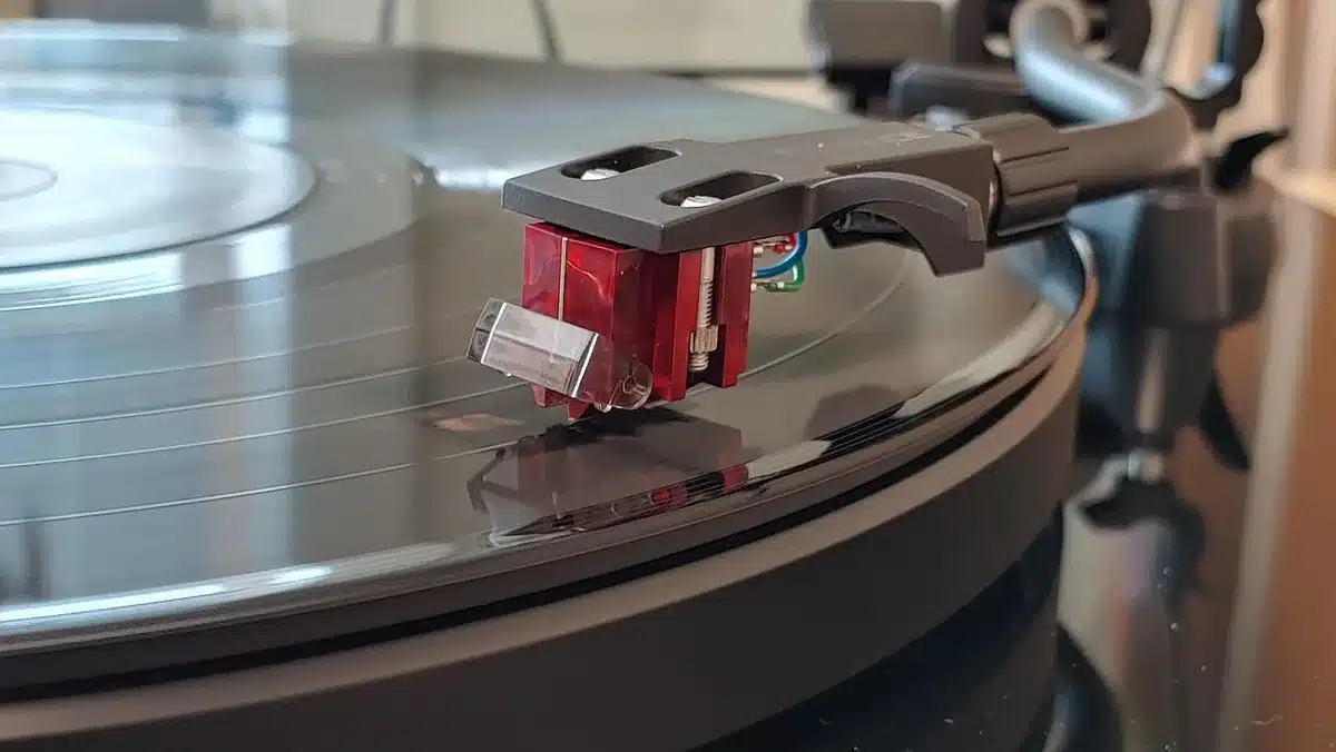 Close-up of a 7-inch vinyl sleeve showing tracklist stickers