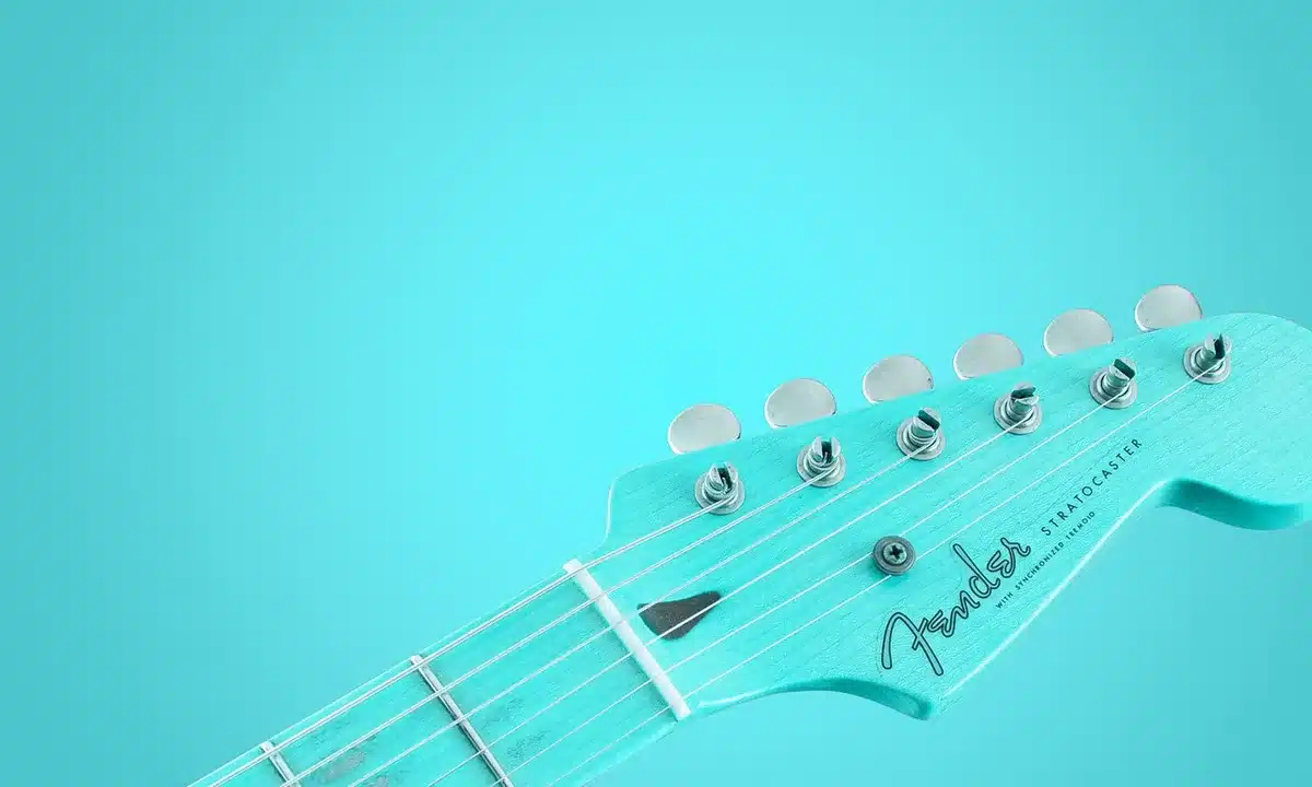 Stacked electric guitars and studio gear illustrating dense guitar textures