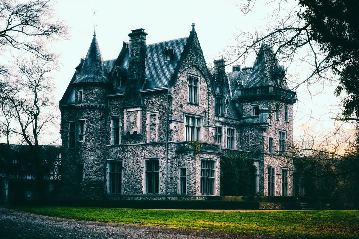 A weathered mansion at dusk suggesting secrets and inheritance