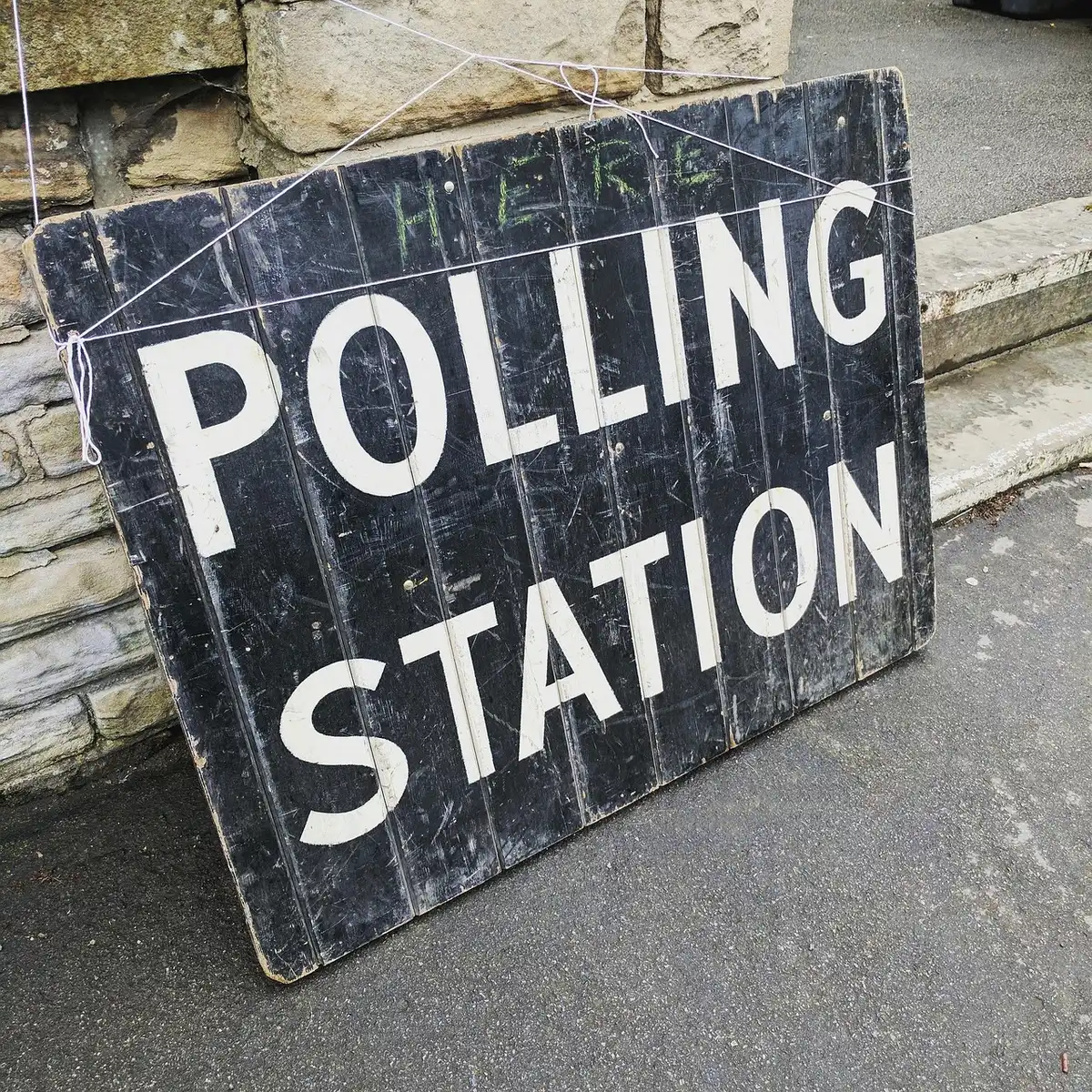 Voters casting ballots at a polling location