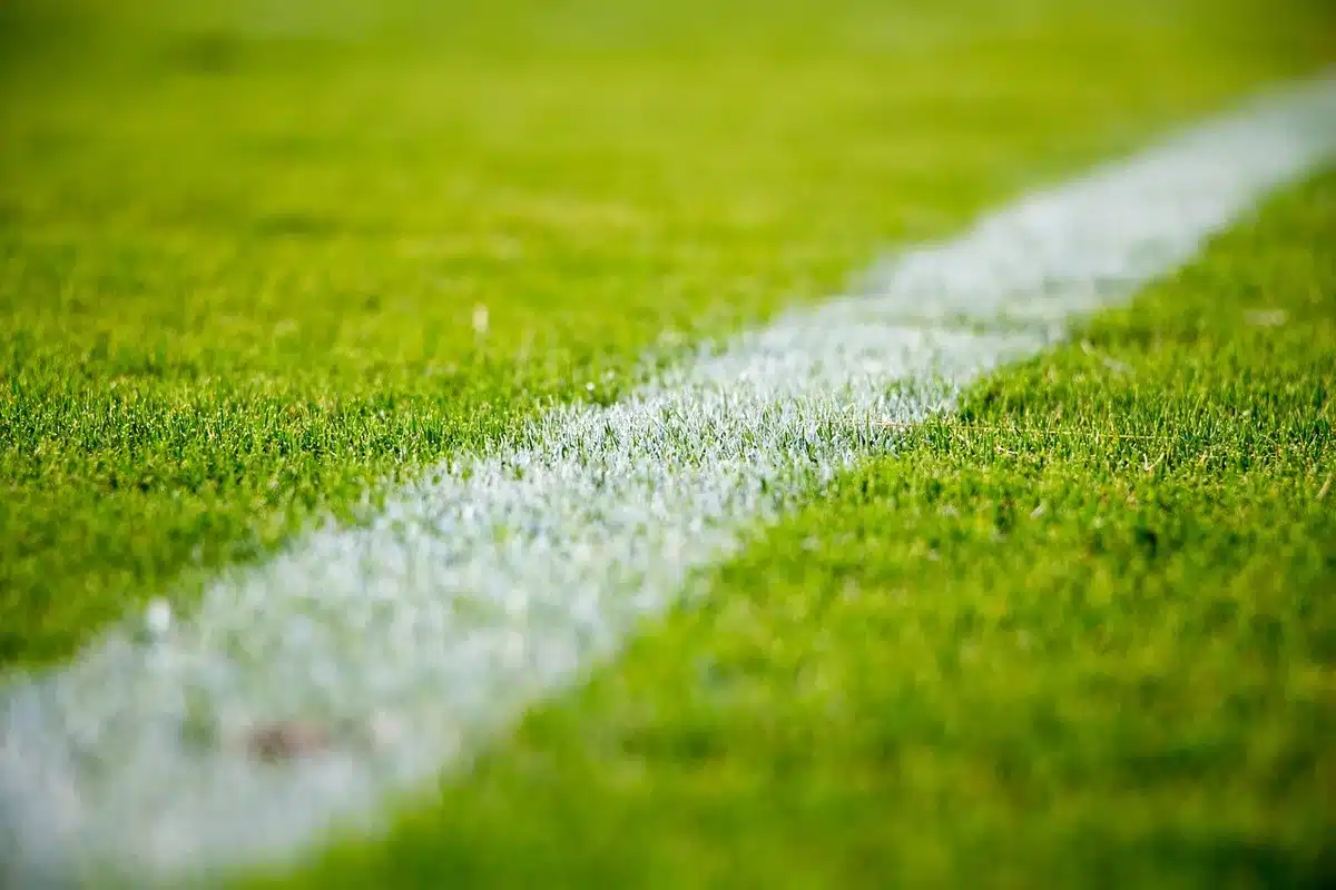 Camera mounted on a tall tripod positioned near midfield