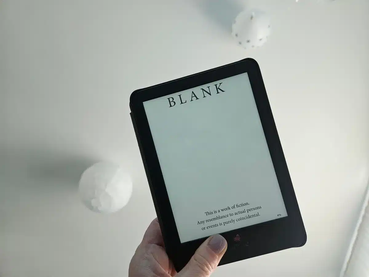 Flush-front e-reader face showing smooth bezel-less display