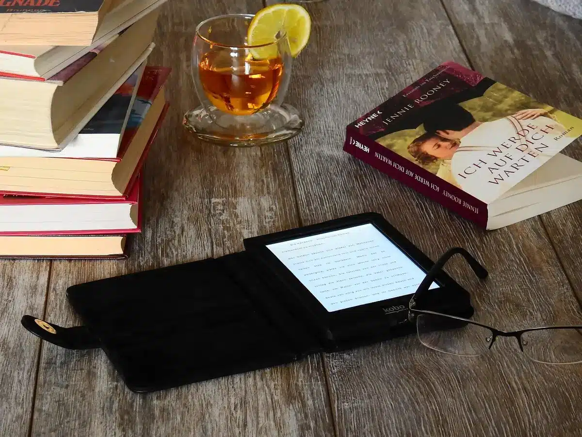 Light e-reader being placed into a small bag pocket to show portability