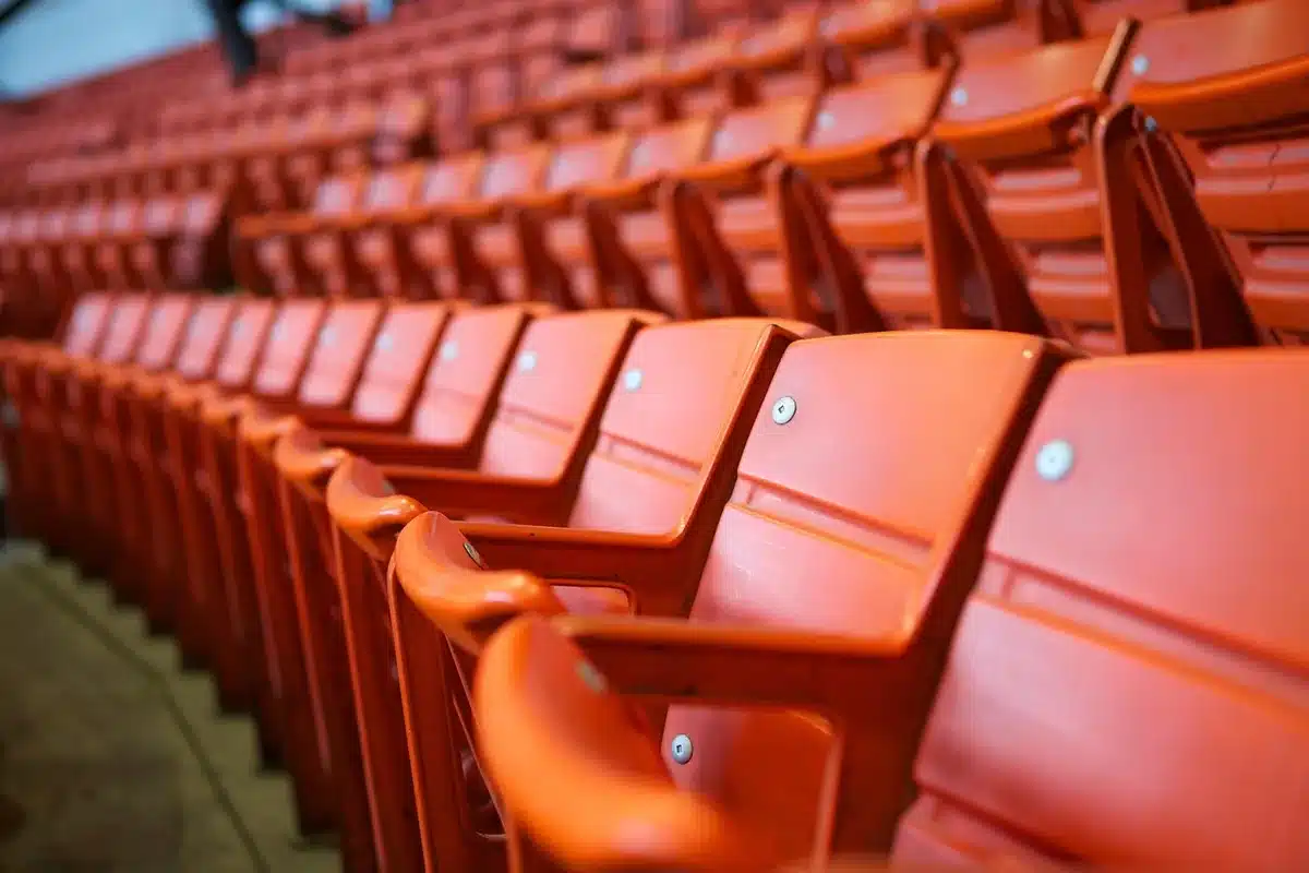 Audience with gaps of empty seats emphasizing front-row vacancy