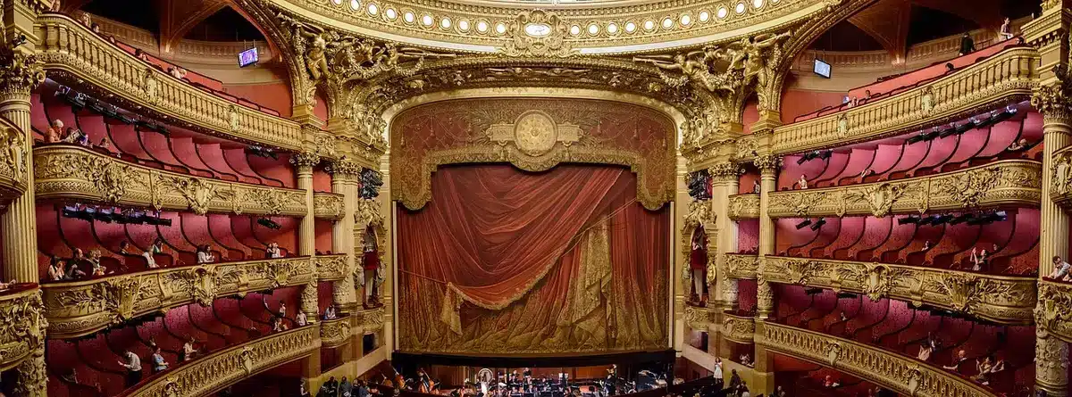 Empty stage with dim lights and an unused microphone