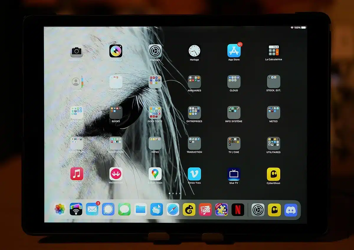 iPad-style tablet on a table with accessories, generic and logo-free