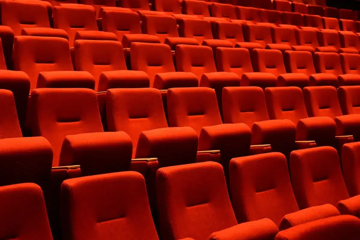 Interior of an IMAX-style theater with a very large curved screen