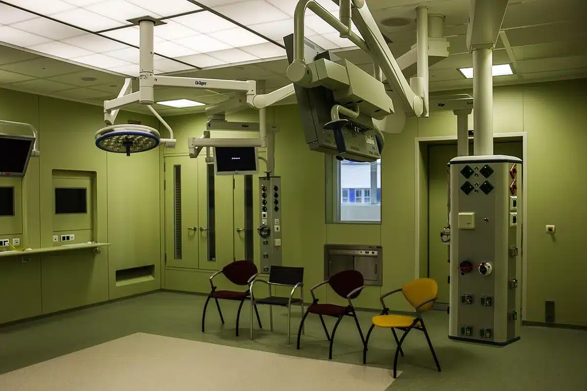 Bright neurosurgical operating room with equipment and monitors