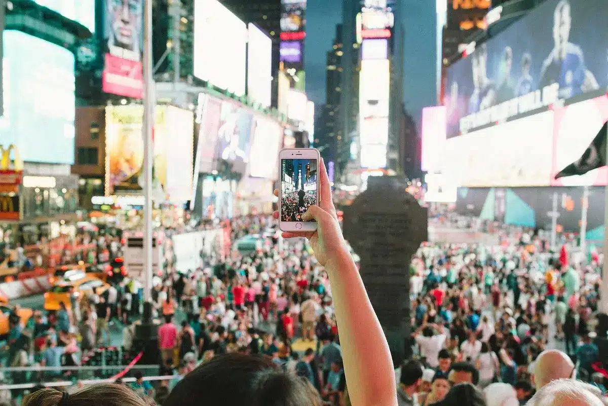 Audience holding phones recording and sharing concert moments