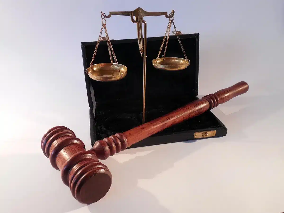 Gavel beside medical documents suggesting legal implications of health issues