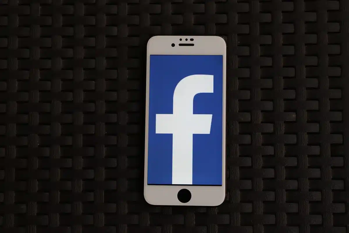 Smartphone showing a social media post explaining a tour change