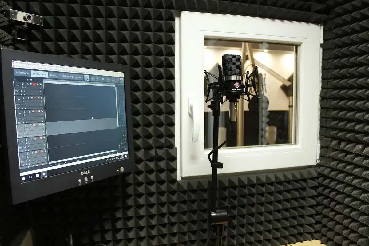 Close-up of a studio microphone and pop filter during a recording session