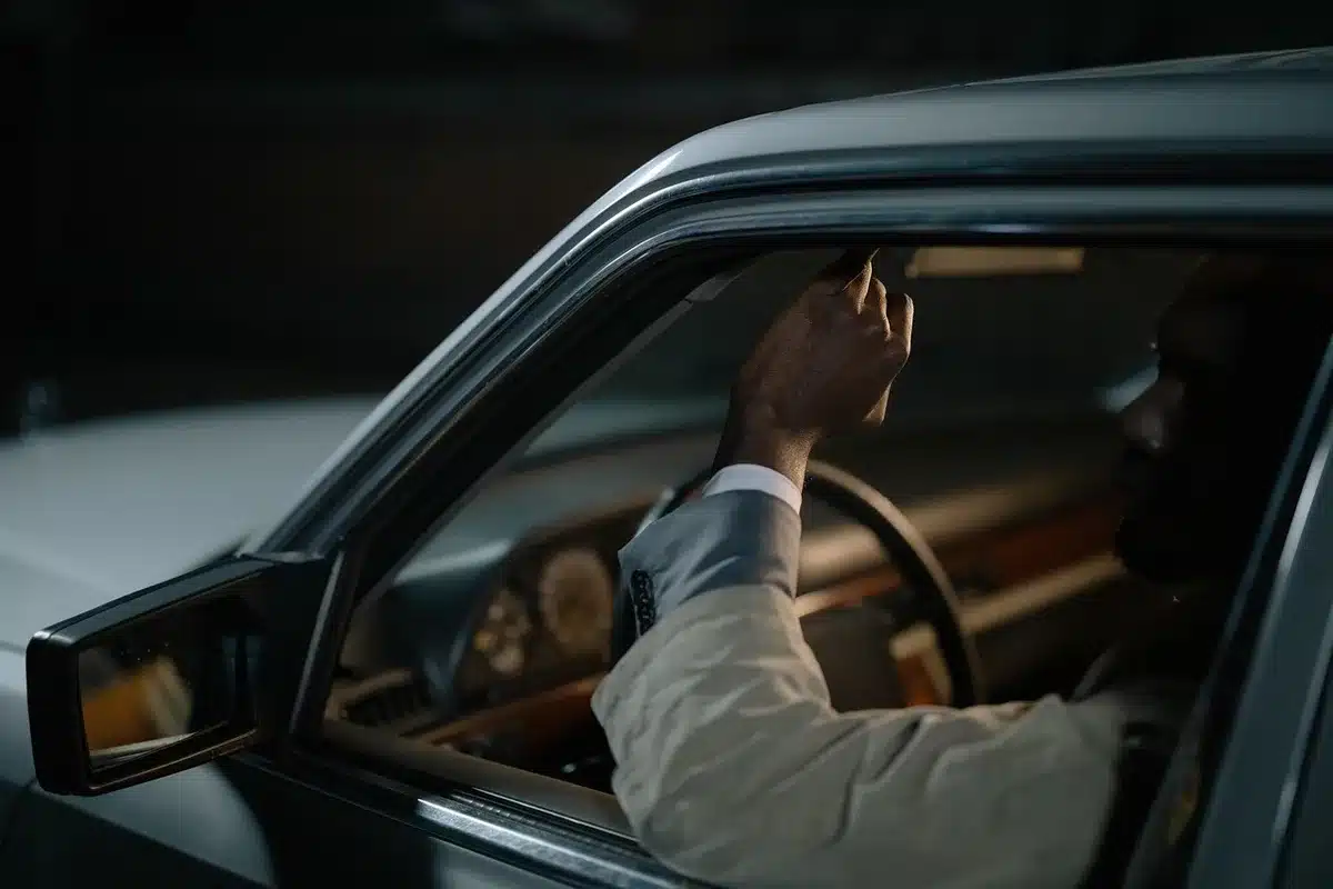 Silhouette of a car interior at night suggesting a tense drive