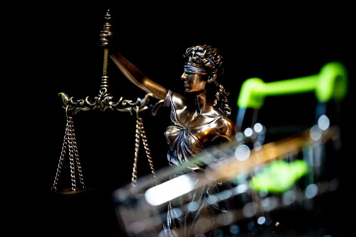 Silhouetted lawyers and tense exchange in a courtroom