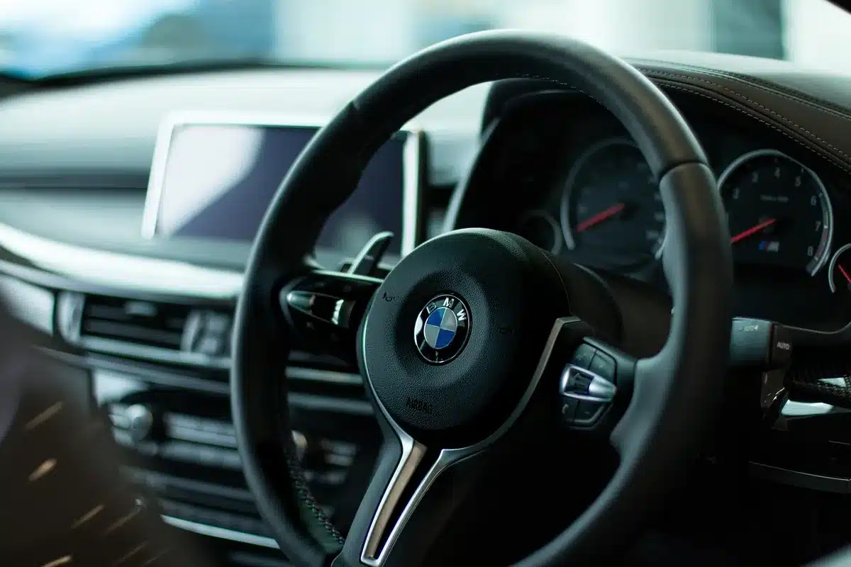Neon-lit dashboard and rain-slick street suggesting Kavinsky's noir synth mood