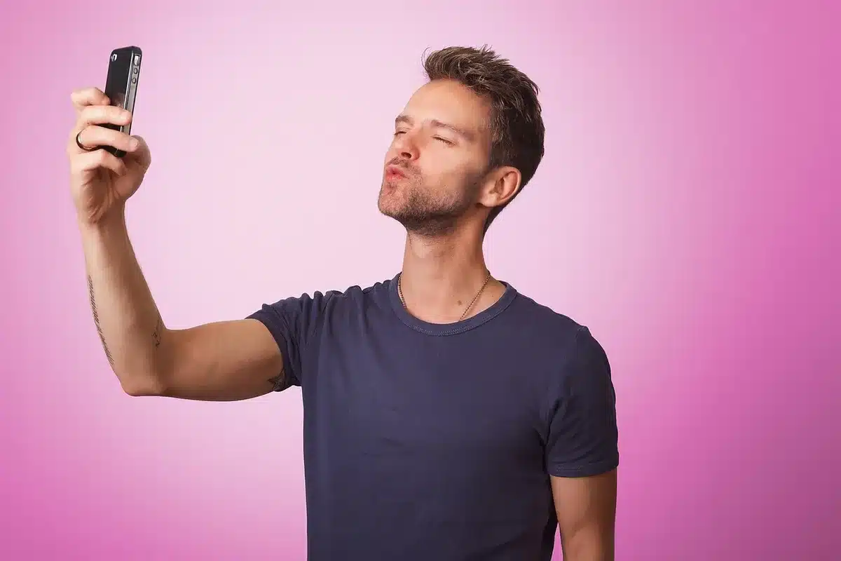 A creator recording a humorous reaction video on a phone