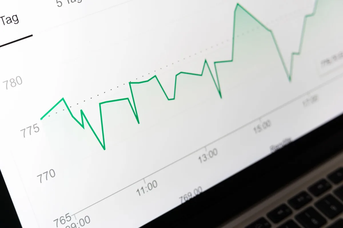 Illustration of pricing test metrics and charts on a computer screen