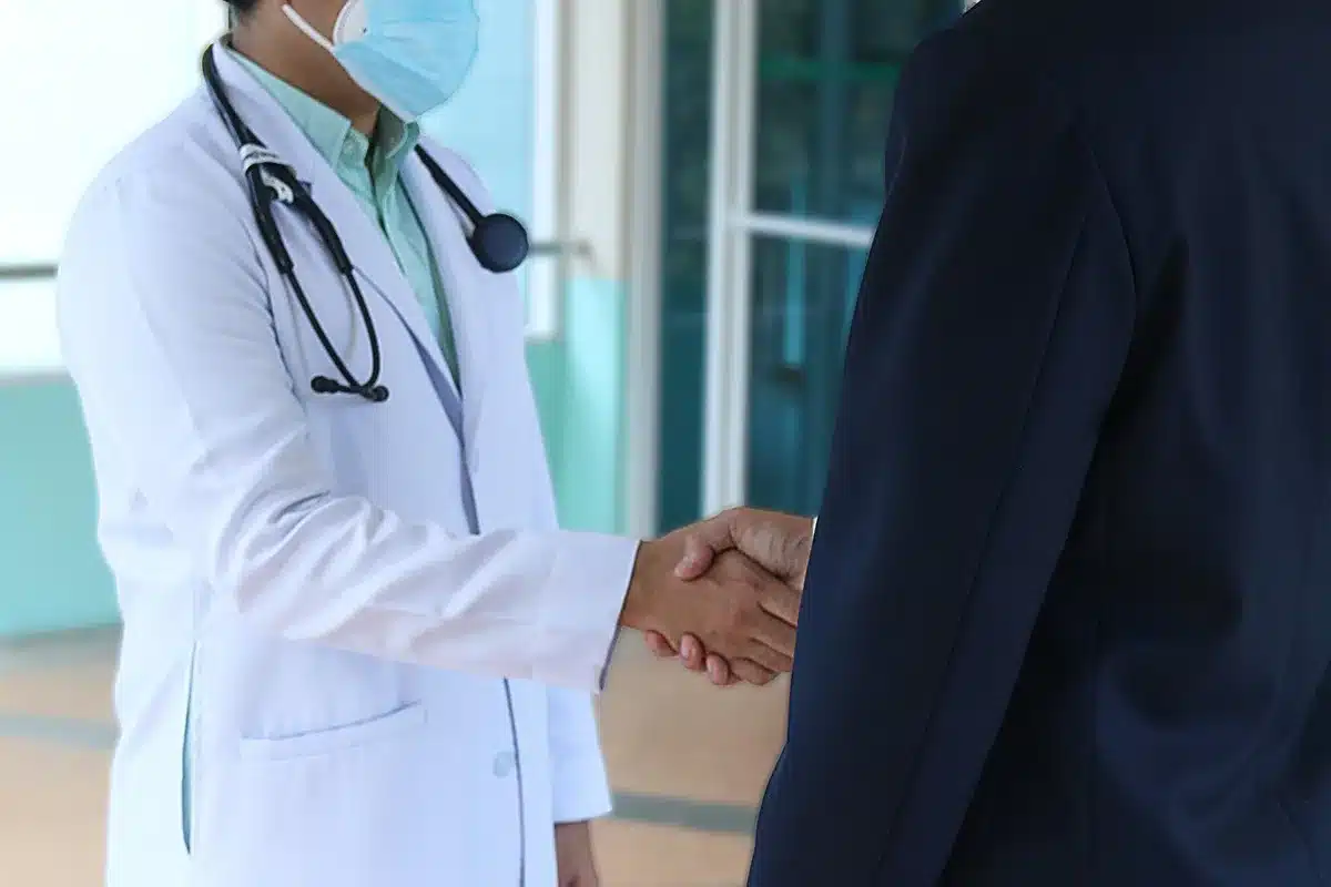 Two healthcare professionals in discussion in an office