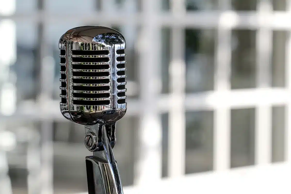 Microphone and printed lyric sheet in a studio setting