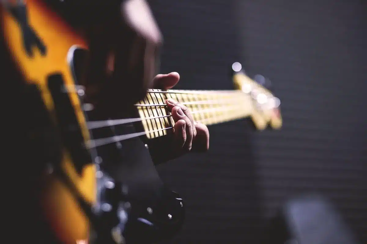Two-piece band on stage with guitar and drums capturing riff-driven rock energy