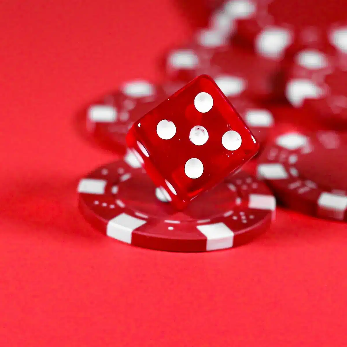 Cellphone recording a blackjack table with players and dealer in the background