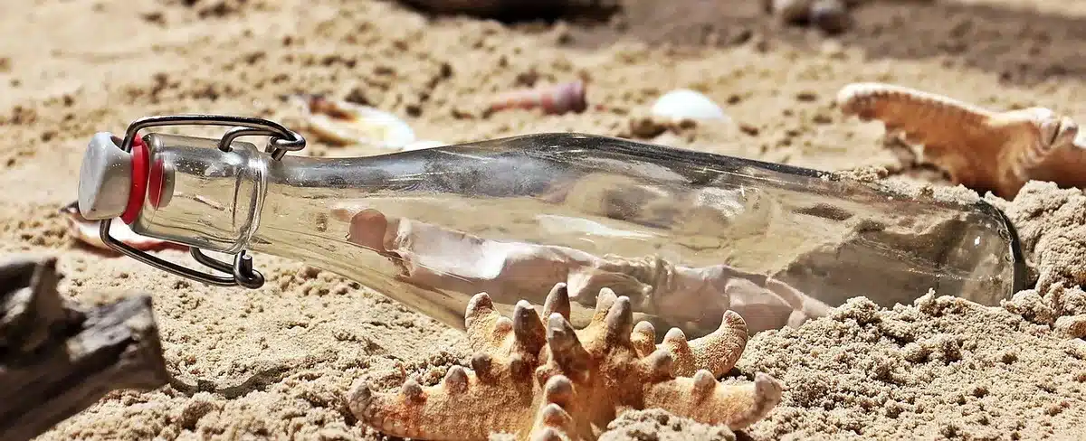 hands holding reusable water bottles using a sip-and-chug lid
