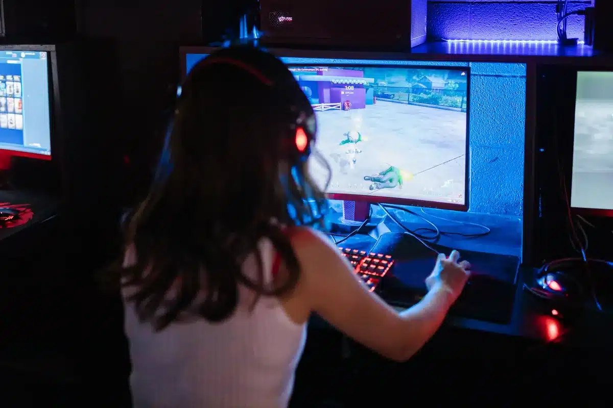 Gamer reacting to fast-paced action with a high refresh monitor