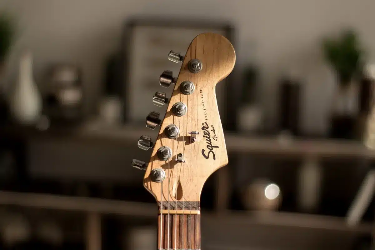 Stacked electric guitars and amp cabinets to illustrate thick, layered guitar textures