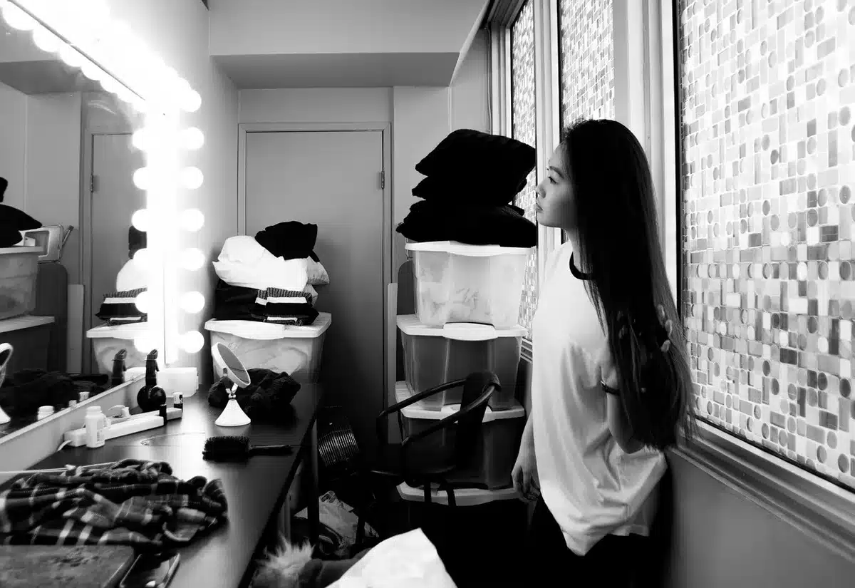 Actor preparing for a role, studying a script in a dressing room