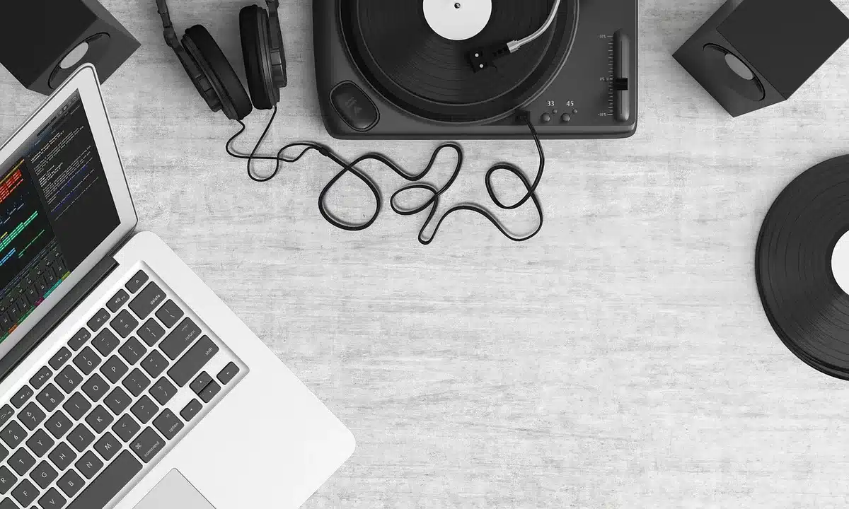 Empty home studio with microphone and laptop symbolizing a viral music break
