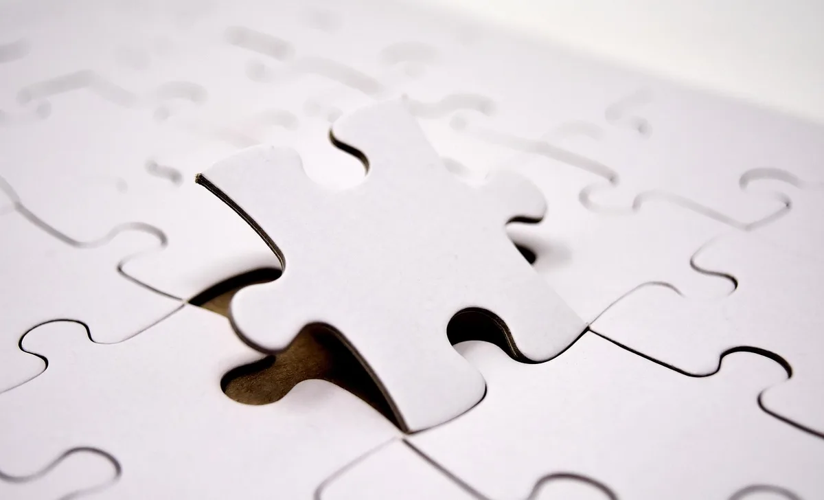 Printed list of word puzzle clues on paper with a pencil