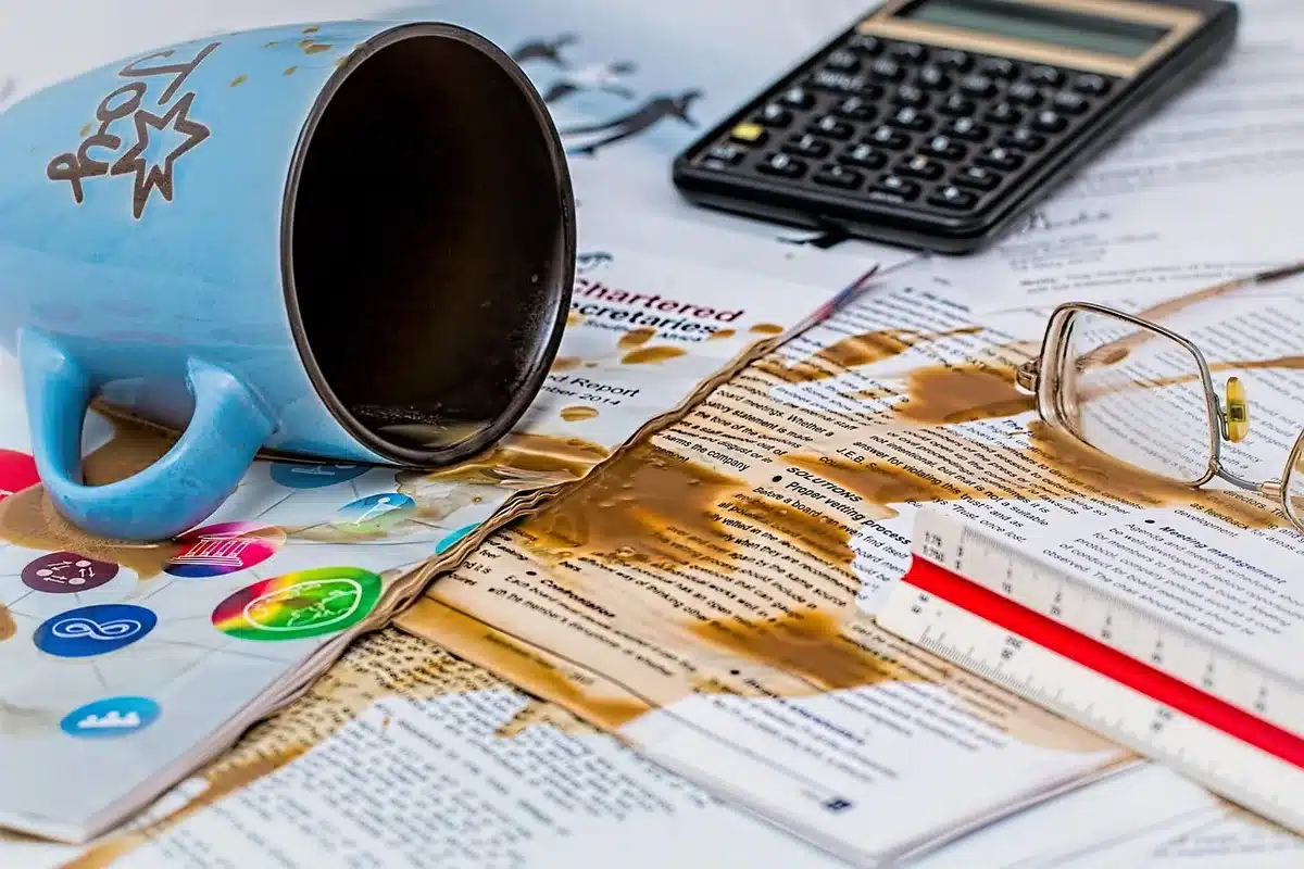Stack of budget papers and a calculator on a desk illustrating fiscal questions
