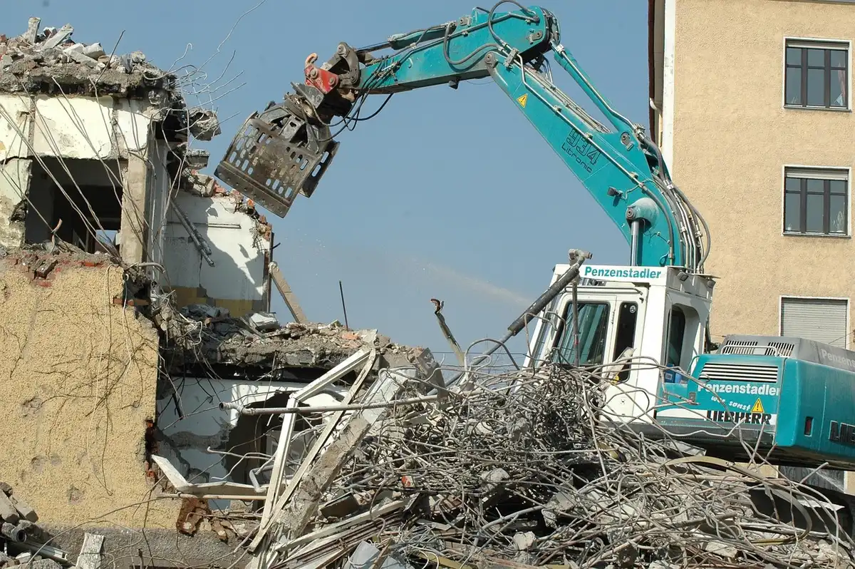 Demolition site with fragments of an ornate façade scattered