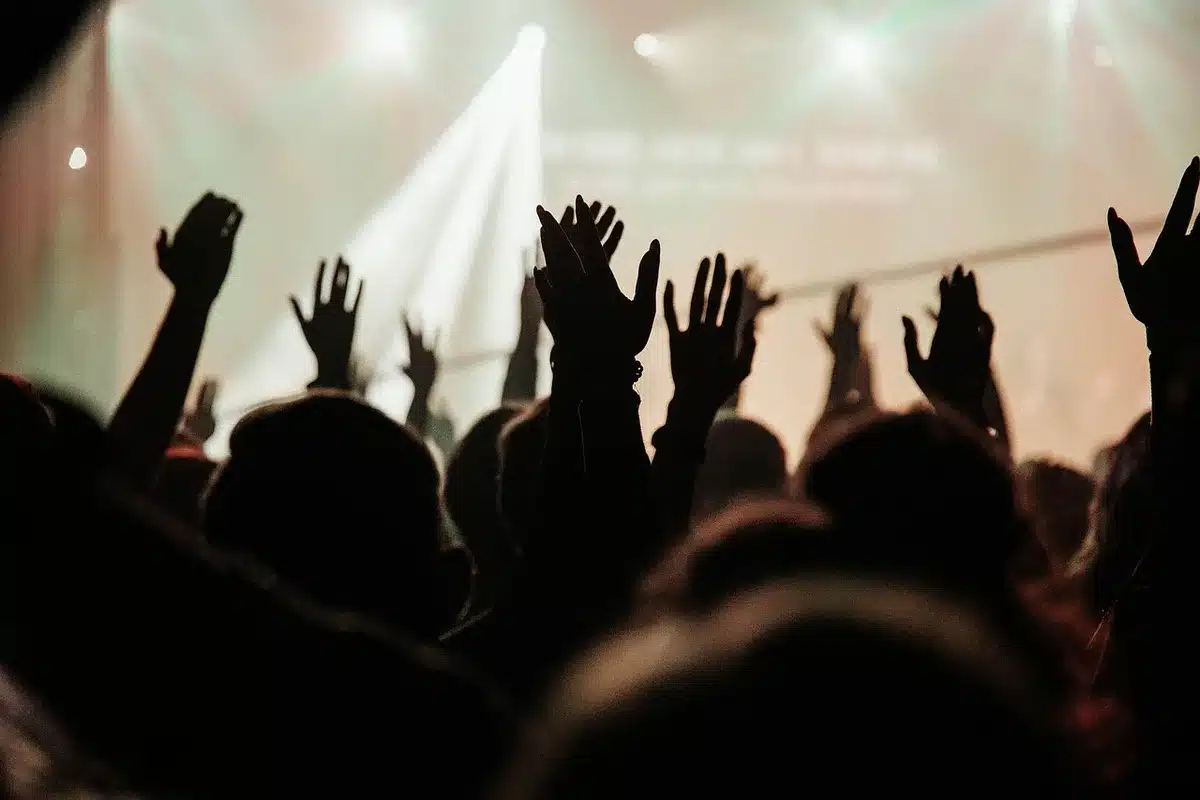 Audience reacting with surprise and laughter at a live concert