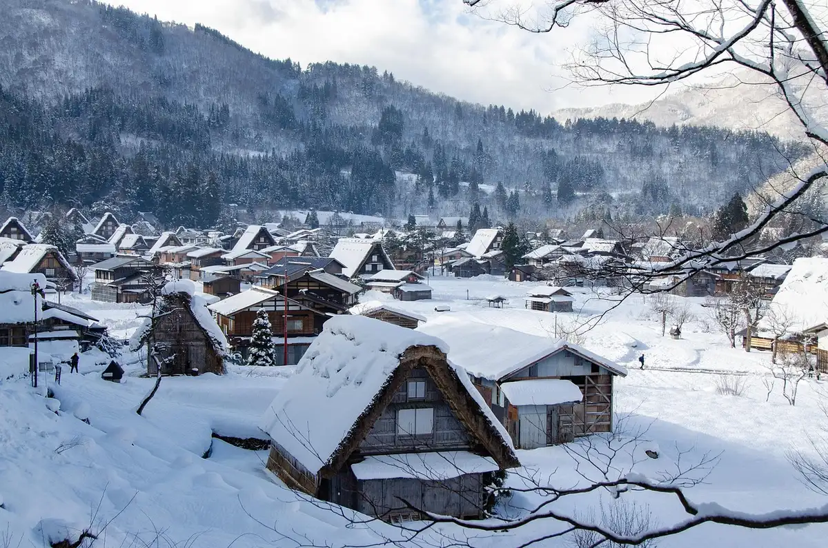 A narrow medieval village street with rustic timber houses